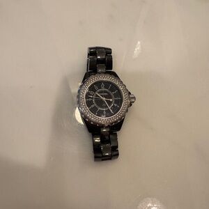 Chanel J12 watch in black ceramic with a diamond-set bezel